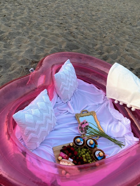 An inflatable pool setup on the beach.